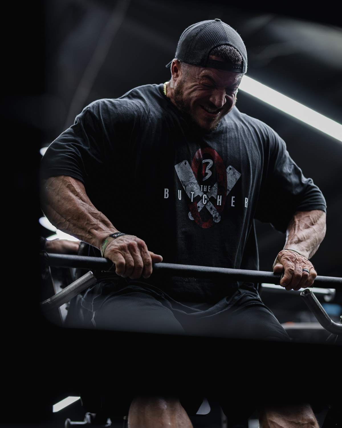 Athlete training hard in the gym wearing The Butcher gear